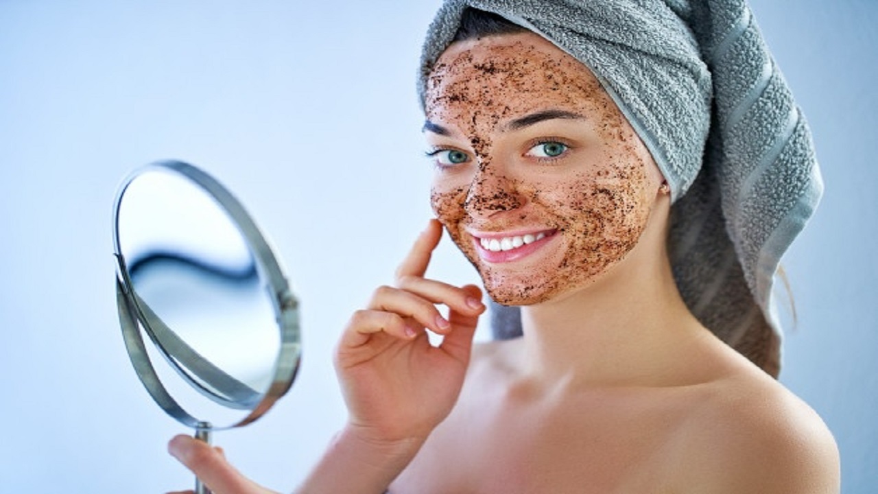 smiling-happy-woman-bath-towel-with-natural-face-coffee-scrub-mask-after-shower_122732-2282